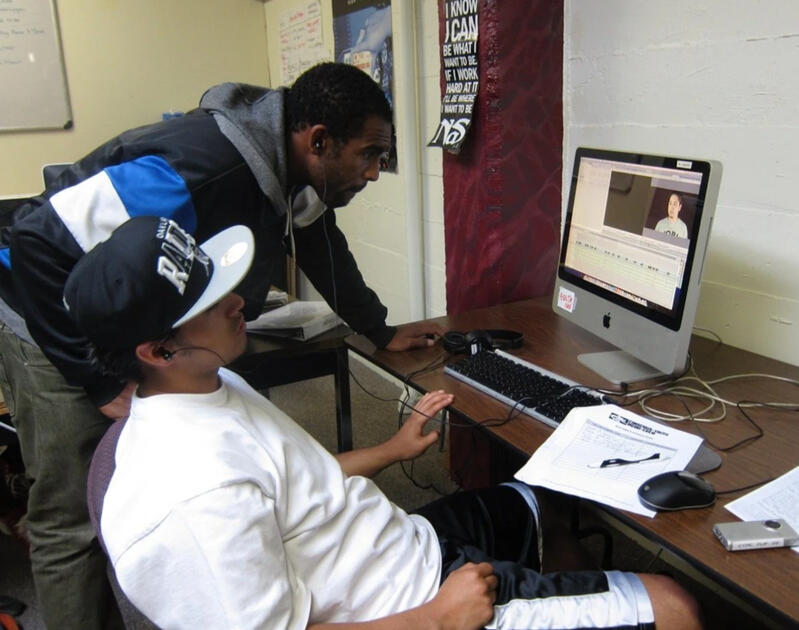 Jordan Brown headshot with light blue background